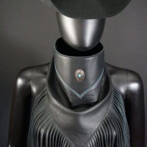 Black leather Bandalero with oval concho, accent blue/silver stitching and fringe.