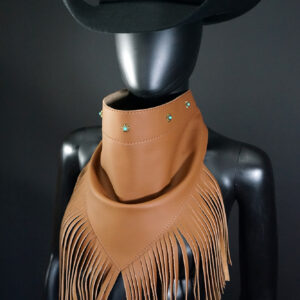Brown leather Bandalero with small conchos and fringe.